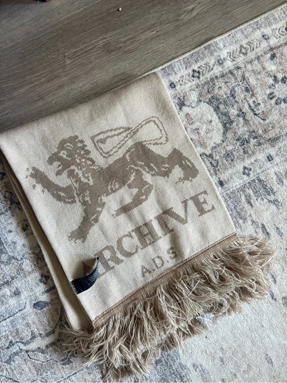 ASOS DESIGN knit Archive graphic scarf in neutral lion